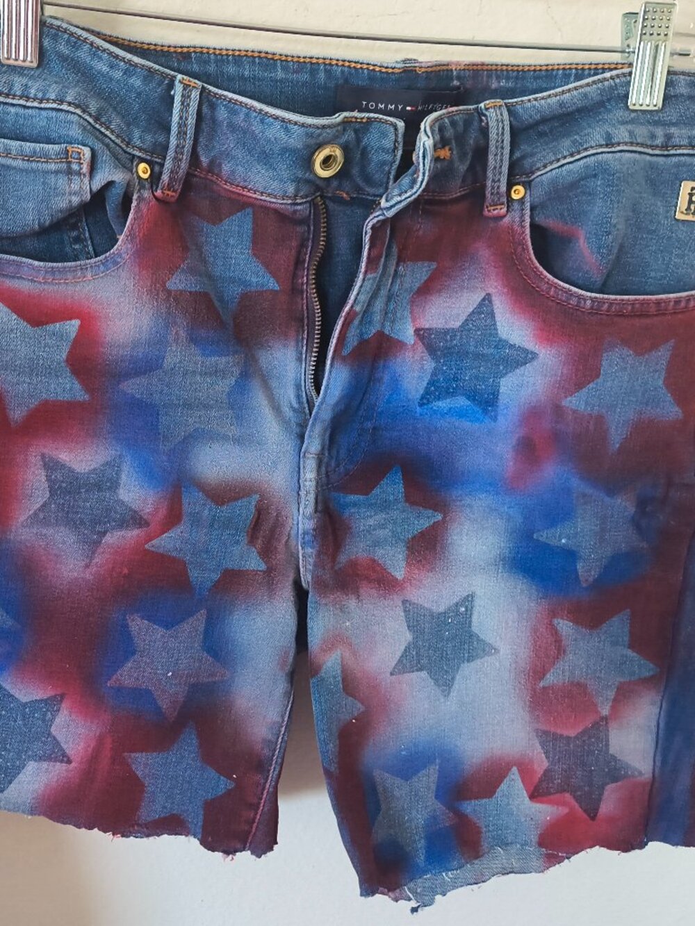 Airbrushed, Patriotic, Fourth of July themed women's blue jean cut-off shorts